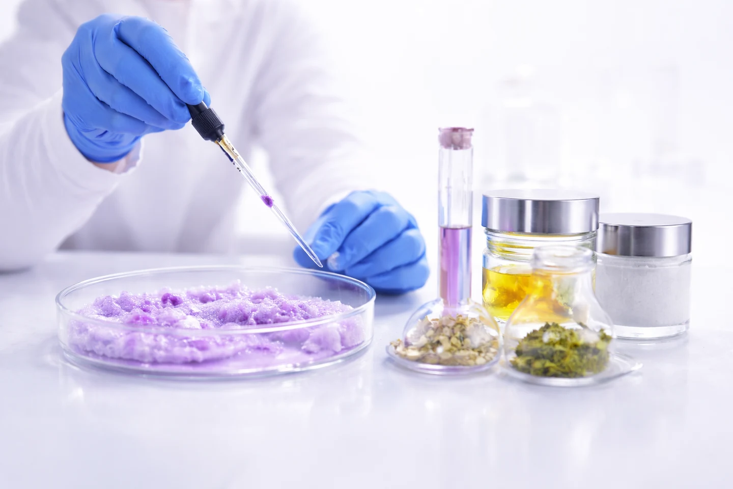 Conceptual image of formulation research with a pipette and material samples