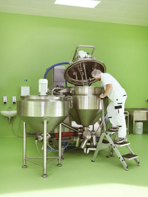 An artefactum team member working at production equipment